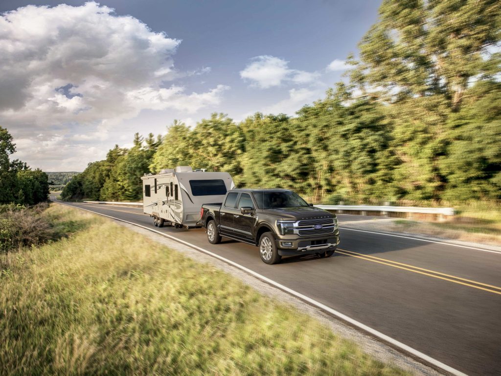 2024 Ford F-150 Platinum in black towing RV