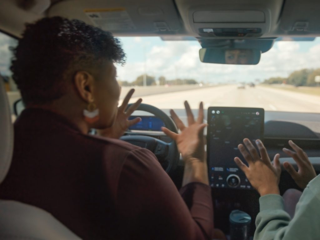 Woman enjoying hands-free driving with Ford BlueCruise