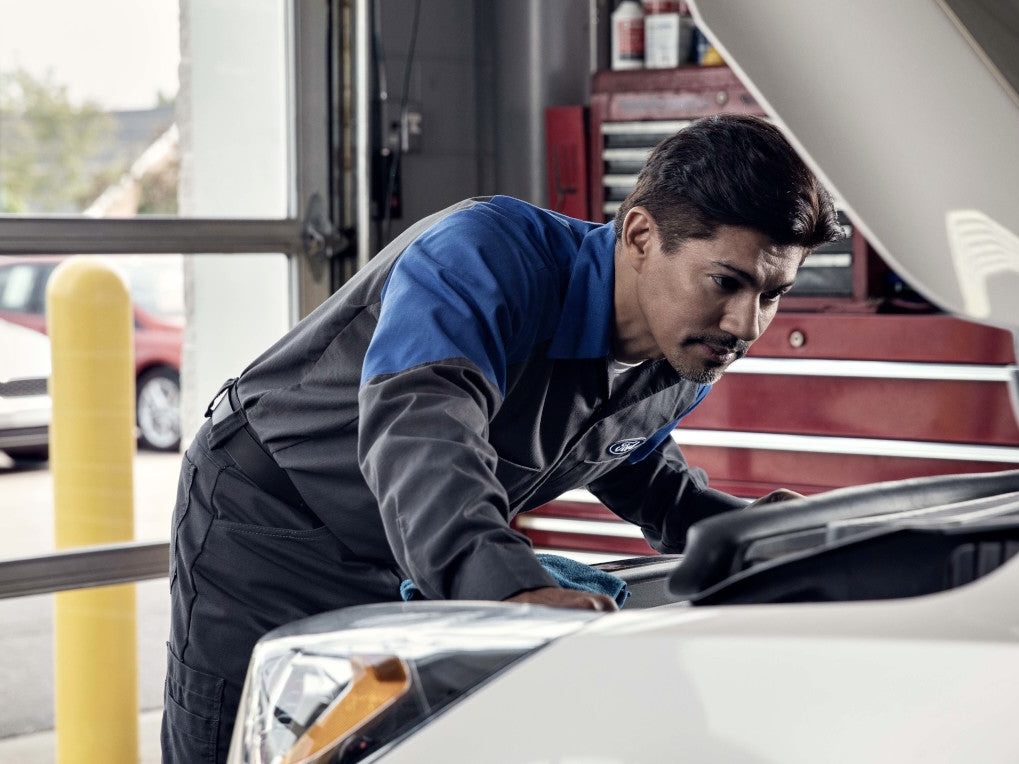 Ford technician performing routine maintenance