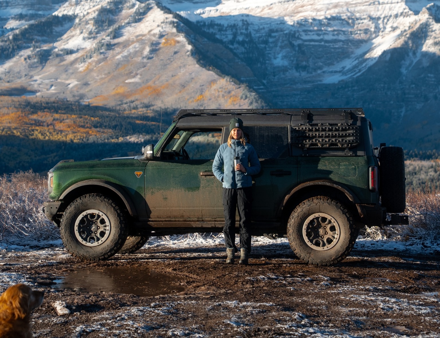woman standing next to ford bronco