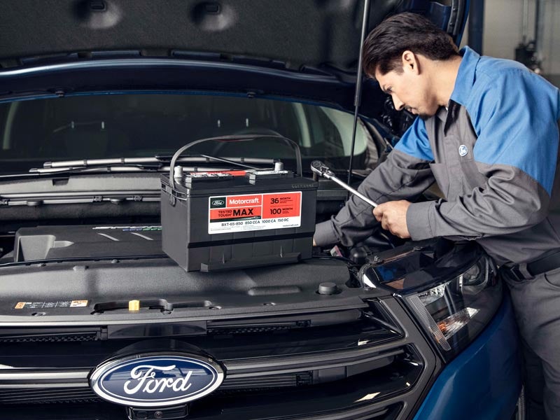 Technician checking a vehicle’s wheel and tire.”