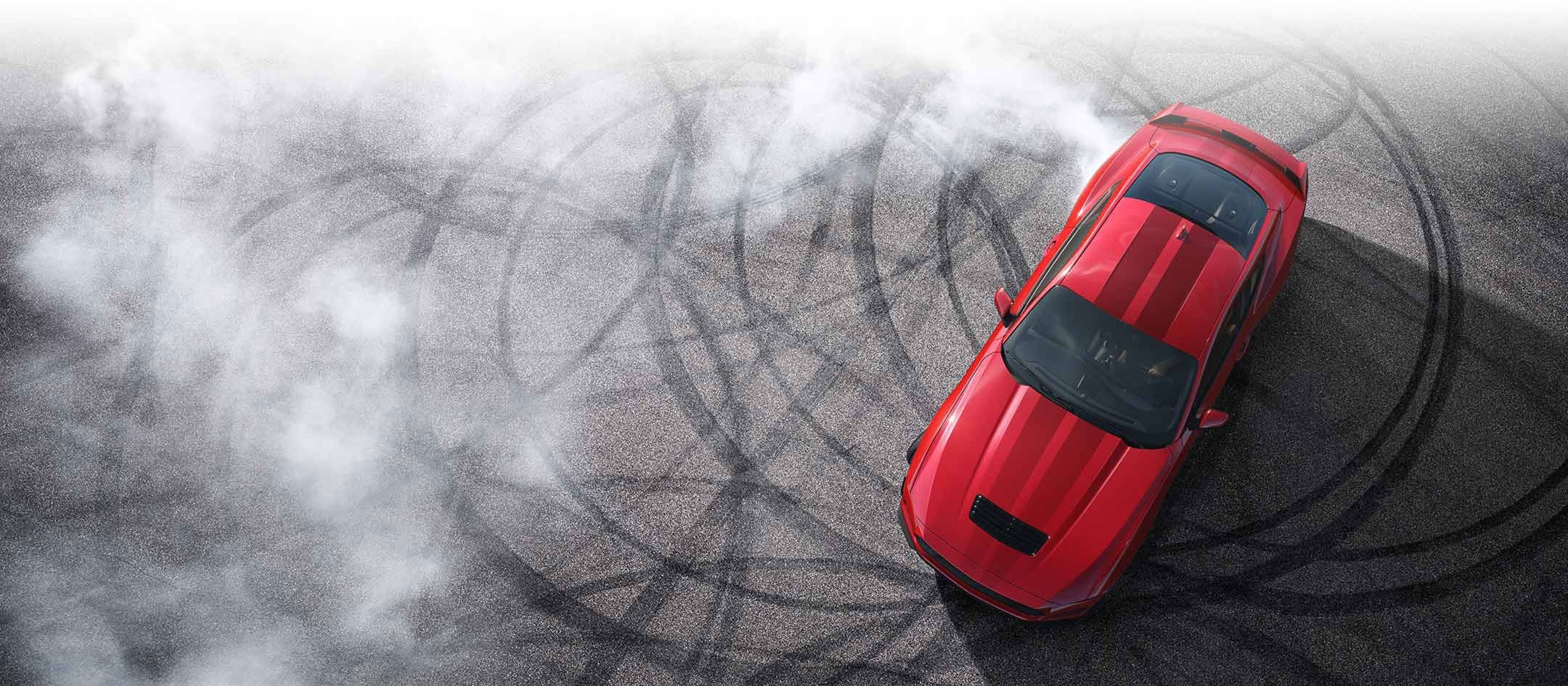 Overhead view of a 2024 Ford Mustang® model with tire tracks on pavement | White's Canyon Ford in Spearfish SD