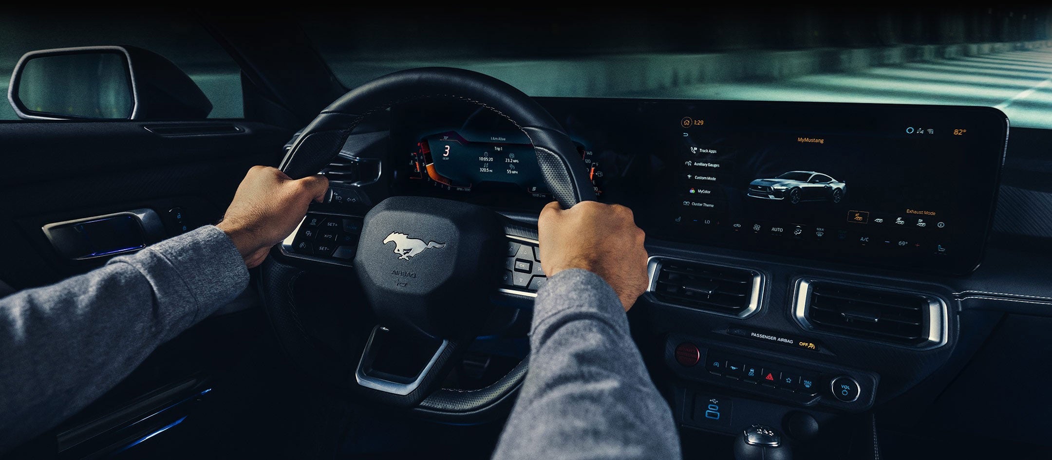 A 2024 Ford Mustang® model interior with a person driving | White's Canyon Ford in Spearfish SD