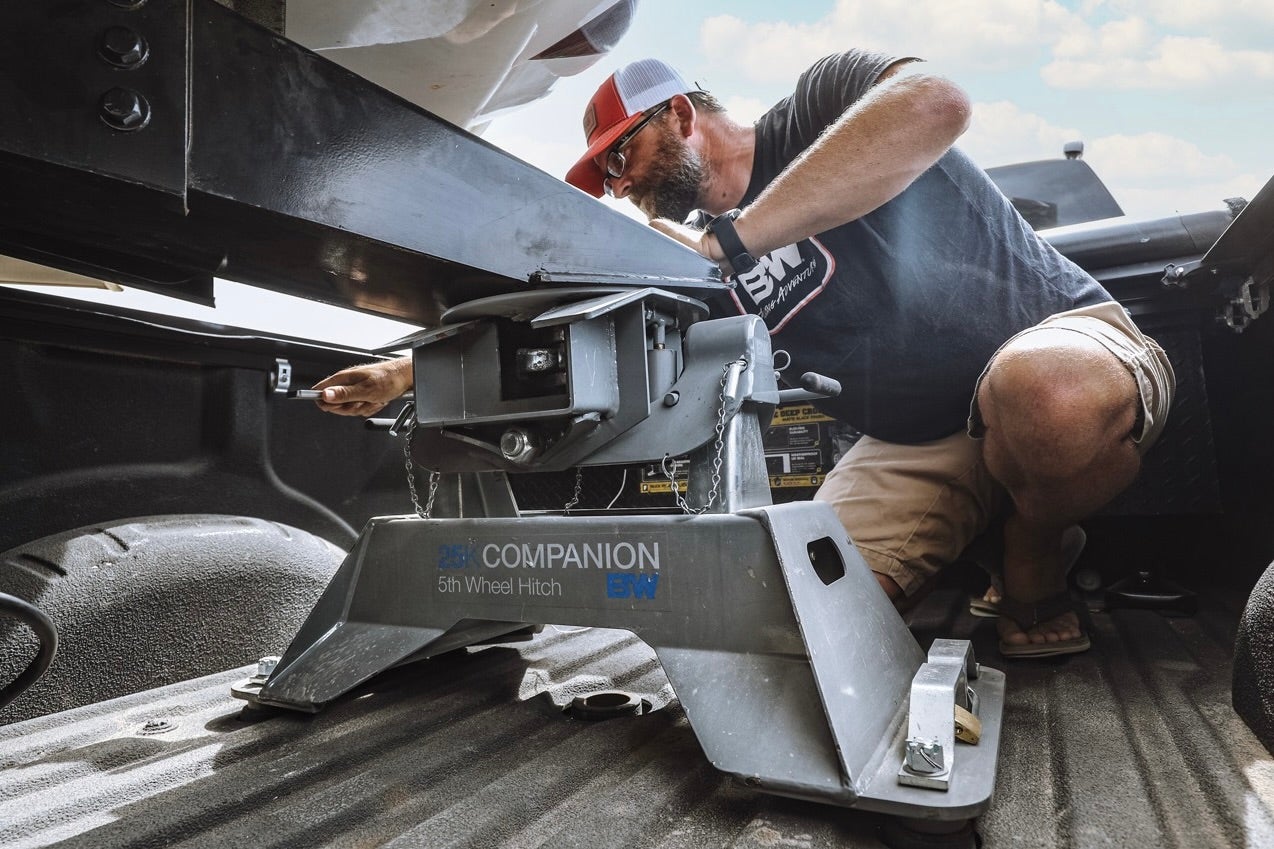 Man installing a Companion OEM Hitch