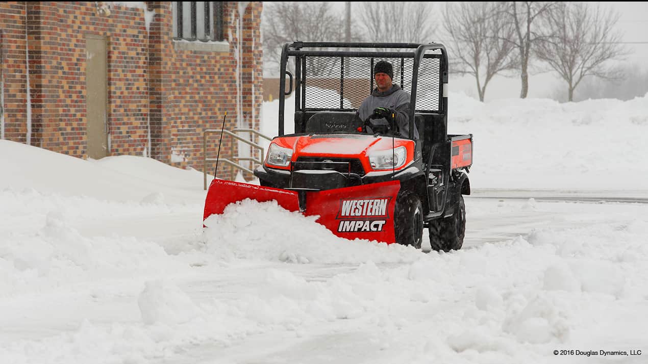 Western IMPACT Snow Plow attached to an UTV