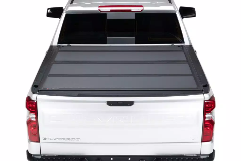 BakFlip MX4 premium hard folding truck bed cover on a white truck