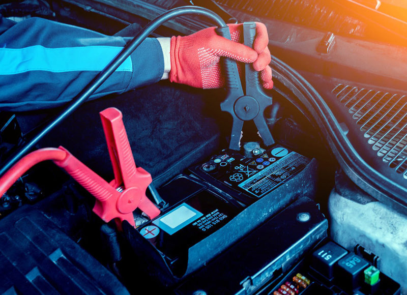 Technician checking a vehicle’s wheel and tire.”