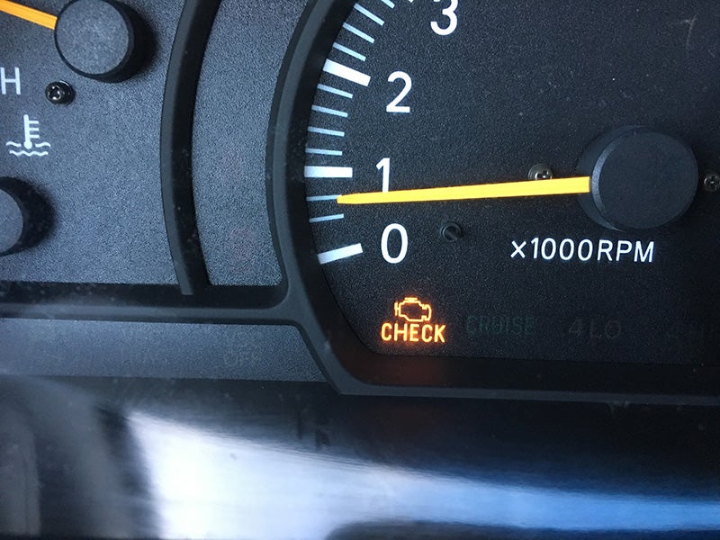 Technician checking a vehicle’s wheel and tire.”