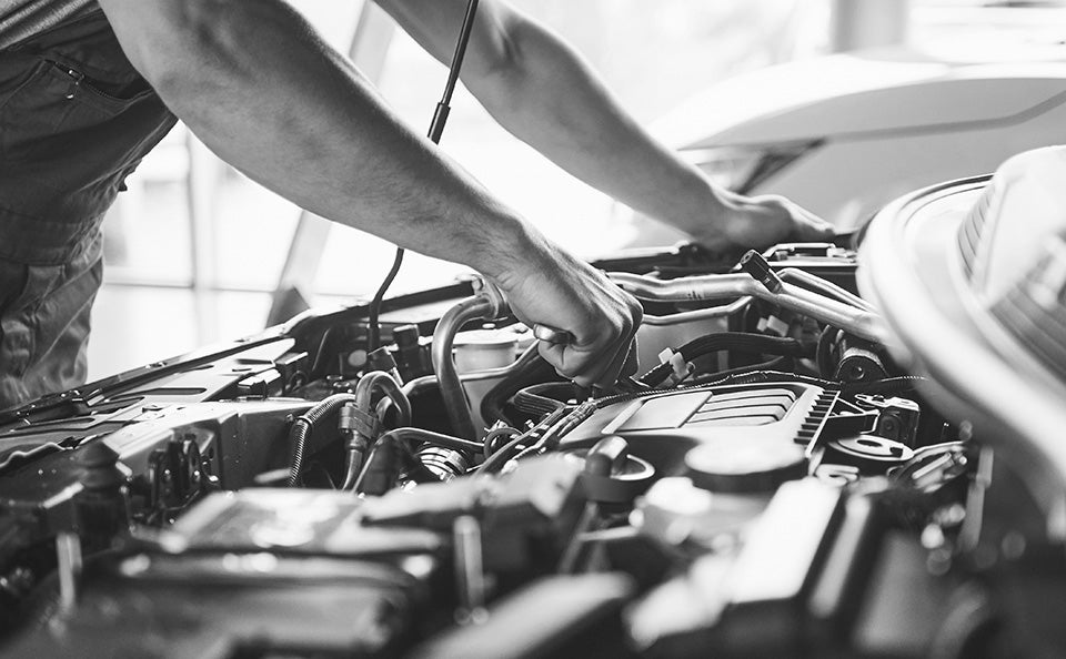 Technician performing a transmission inspection.